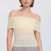 Sovere Studio SOVERE / STUDIO - RISE MESH SLEEVELESS TOP (BUTTERMILK)